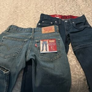 2 pair of boys size 8 levi jeans, one dark one light. Brand new with tags.